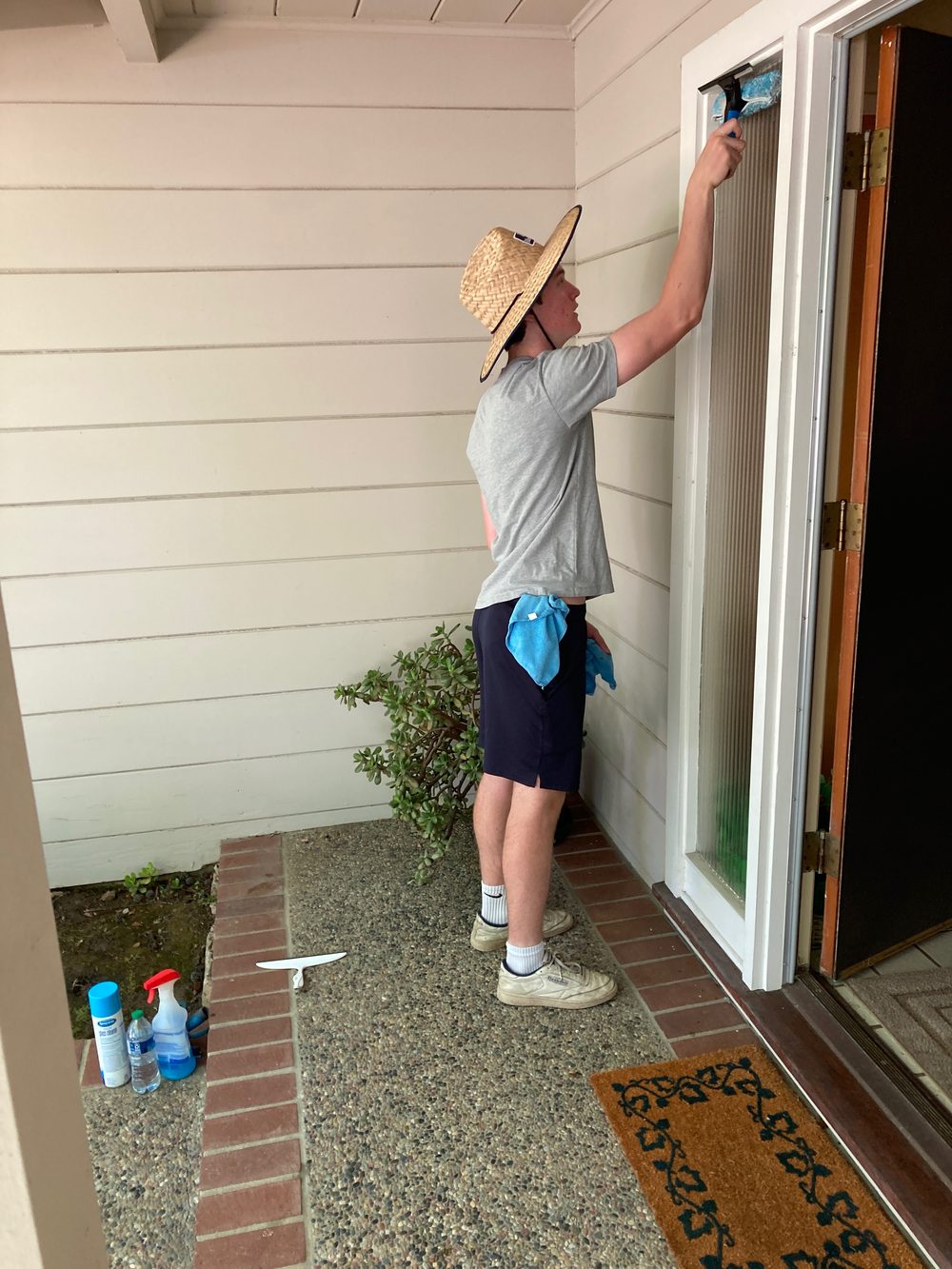 Squeegee cleaning a glass door